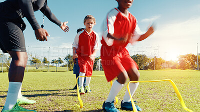 Buy stock photo Group, children and jump for soccer practice for fitness training, balance exercise and sports workout. Kids, drills and hurdles for playing game, learning skills and team challenge of match activity