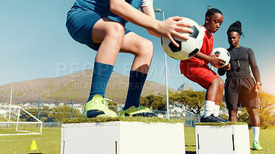 Buy stock photo Children, jumping and ball for soccer practice for fitness training, balance exercise and sports drill. Kids, box and equipment for playing game, learning skills and team challenge for match activity