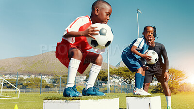 Buy stock photo Black kids, jumping and ball for soccer practice of fitness training, balance exercise and sports drill. Boys, box and equipment for playing game, learning skills and team challenge of match activity