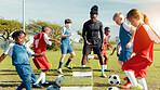 Sports field, soccer player and children with ball, training and athlete with energy for practice in morning. Playing, football and kids with sportswear for game, growth and development with fitness