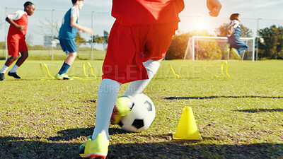 Buy stock photo Soccer player, feet and children with ball, kick and athlete with energy for practice, cardio and legs. Playing, football and kids with sportswear for game, growth and development with fitness