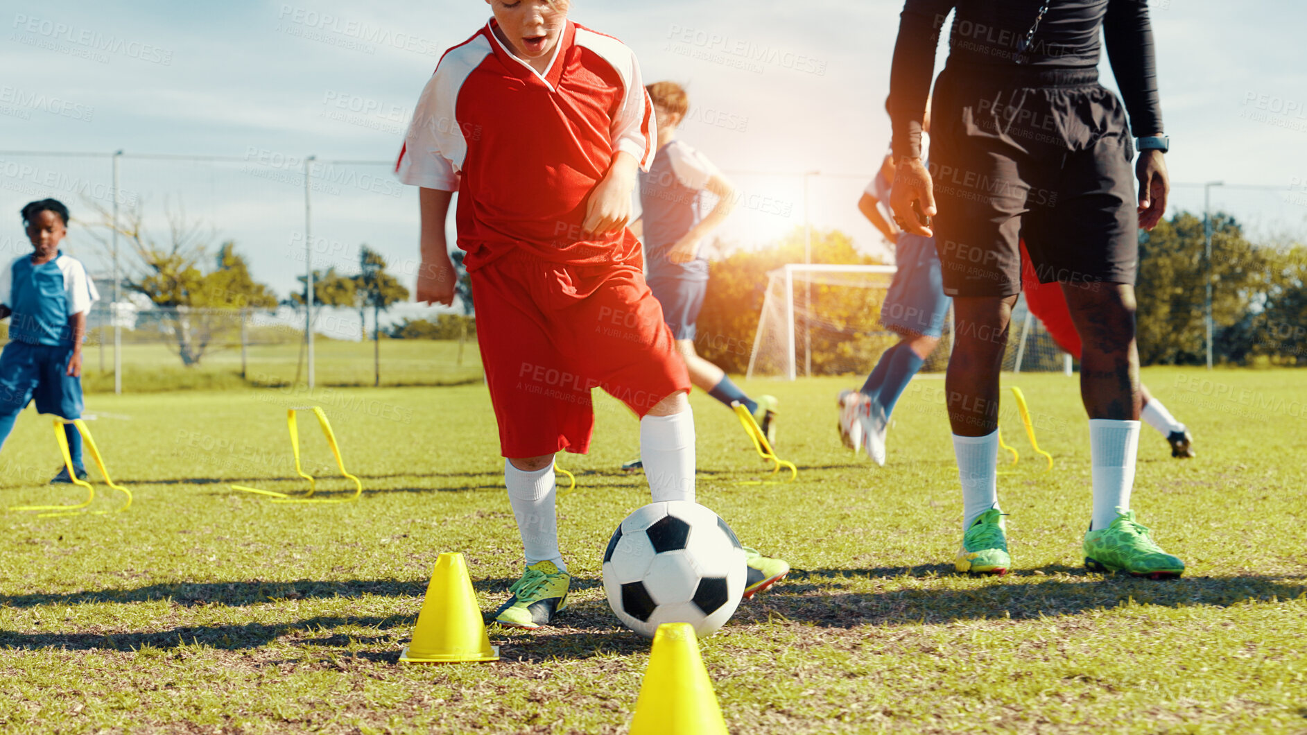 Buy stock photo Sports field, soccer player and children with ball, coach and athlete with energy for practice in morning. Playing, football and kids with sportswear for game, growth and development with fitness