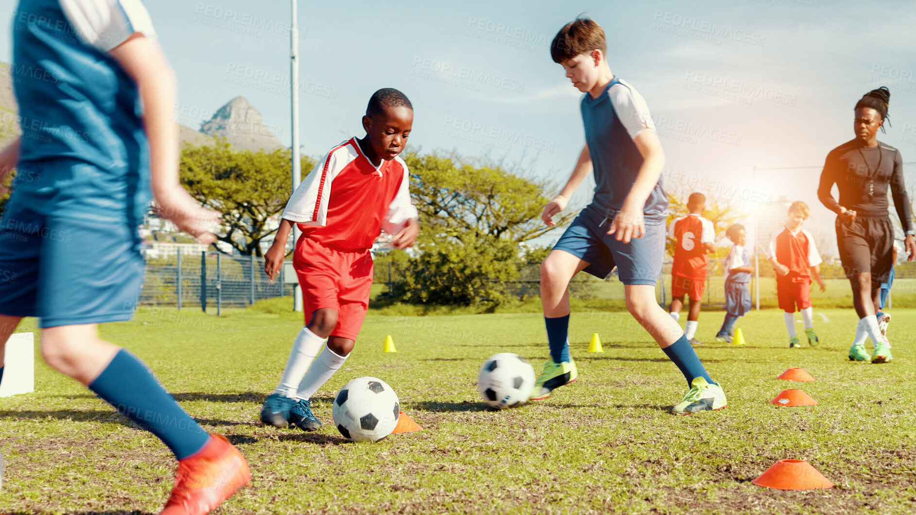 Buy stock photo Sports field, soccer player and children with ball, kick and athlete with energy for practice in morning. Playing, football and kids with sportswear for game, growth and development with fitness