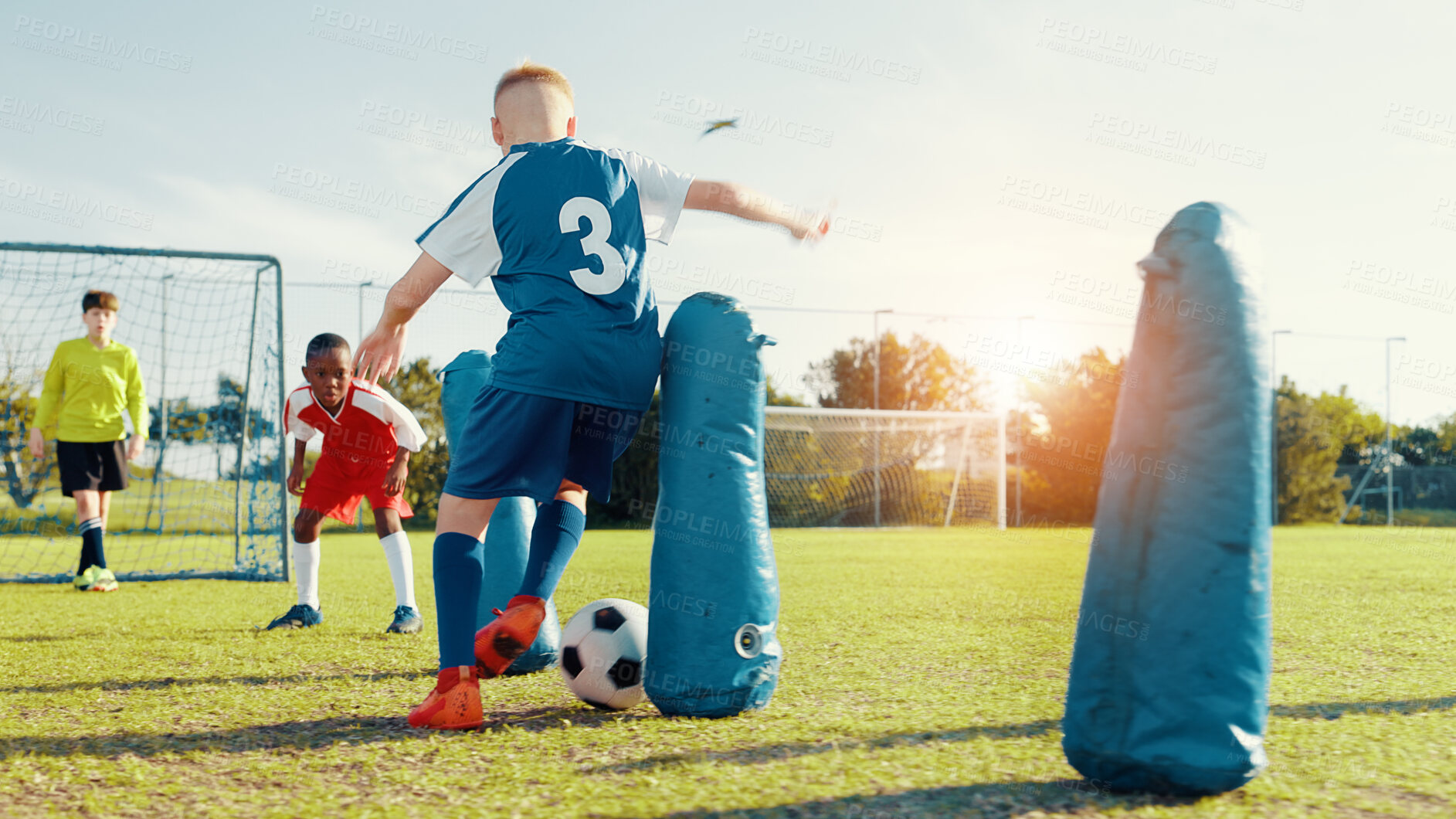 Buy stock photo Sports field, soccer player and children with ball, match and athlete with energy for practice in morning. Playing, football and kids with sportswear for game, growth and development with fitness