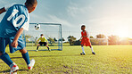 Sports field, soccer player and children with ball, goal and athlete with energy for practice in morning. Playing, football and kids with sportswear for game, growth and development with fitness