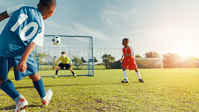 Buy stock photo Sports field, soccer player and children with ball, goal and athlete with energy for practice in morning. Playing, football and kids with sportswear for game, growth and development with fitness