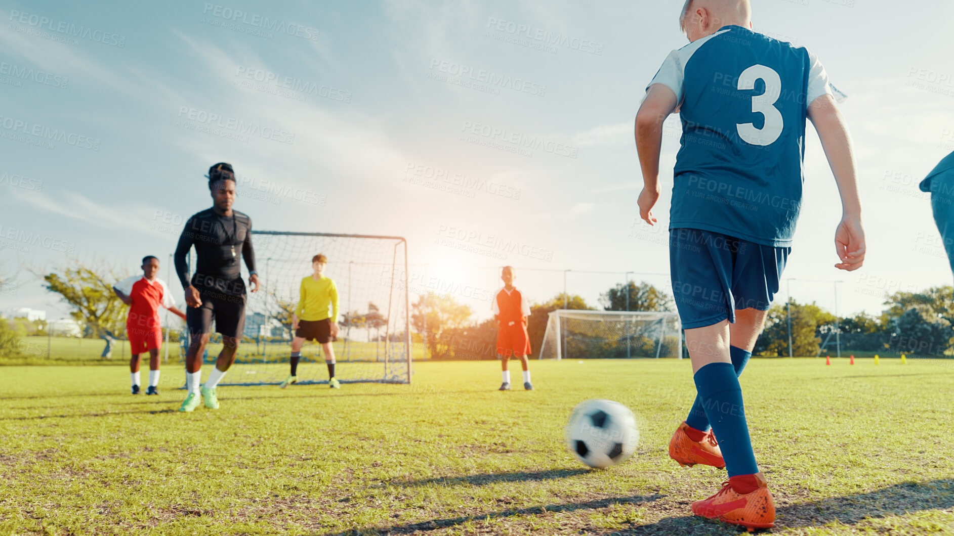 Buy stock photo Practice, soccer player and children with ball, kick and athlete with energy for training in morning. Sports field, football and kids with sportswear for game, growth and development with fitness