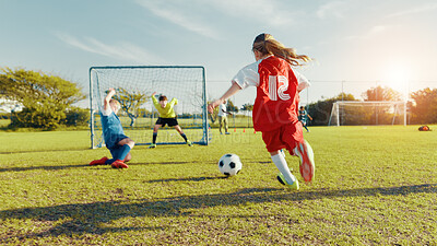 Buy stock photo Sports field, kick and soccer player with skills, children and athlete with energy for match and cardio. Playing, football and kids with sportswear for game, growth and development of girl or back