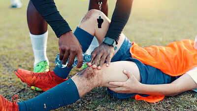 Buy stock photo Soccer, child and water for injury, knee pain and muscle tension for scrape in sports competition. Football field, hands and coach with boy for helping, support and tendinitis emergency for kid