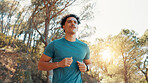 Man, fitness and running with workout for exercise, cardio training or marathon in nature. Active, male person or runner jogging with trees or sunshine for outdoor race, sprint or health and wellness