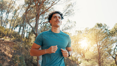 Buy stock photo Man, fitness and running with workout for exercise, cardio training or marathon in nature. Active, male person or runner jogging with trees or sunshine for outdoor race, sprint or health for wellness