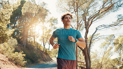 Buy stock photo Man, fitness and running with trees in nature for workout, exercise or cardio training on mountain. Active, male person or runner jogging with path or road for race, sprint or health and wellness
