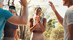 Happy people, fitness and applause with high five in nature for workout goals, winning or teamwork. Active, group or friends clapping with smile for success, exercise or health and wellness together