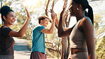 Happy people, fitness and high five in nature for workout goals, winning or teamwork. Active, group or friends with smile or motivation in joy for success, exercise or health and wellness together