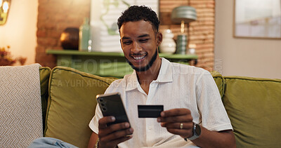 Buy stock photo Home, credit card and man on couch, cellphone and ecommerce with savings, smile or investment. Financial payment, online shopping or person with fintech account, smartphone or digital app for banking