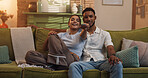 Happy couple, relax or watching tv with remote on sofa for online entertainment, bonding or movie at home. Man, woman or lovers with smile on couch for show, series or streaming subscription at house