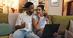 Couple, relax and coffee with laptop on sofa for research, browsing or online entertainment at home. Man, woman or lovers with cup or computer on couch for network, connection or discussion at house