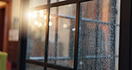 Frame, window and glass with rain in home for wet weather, cold season and winter. Aesthetic, background and closeup of pane with view of water droplets, moisture and condensation for calm in house