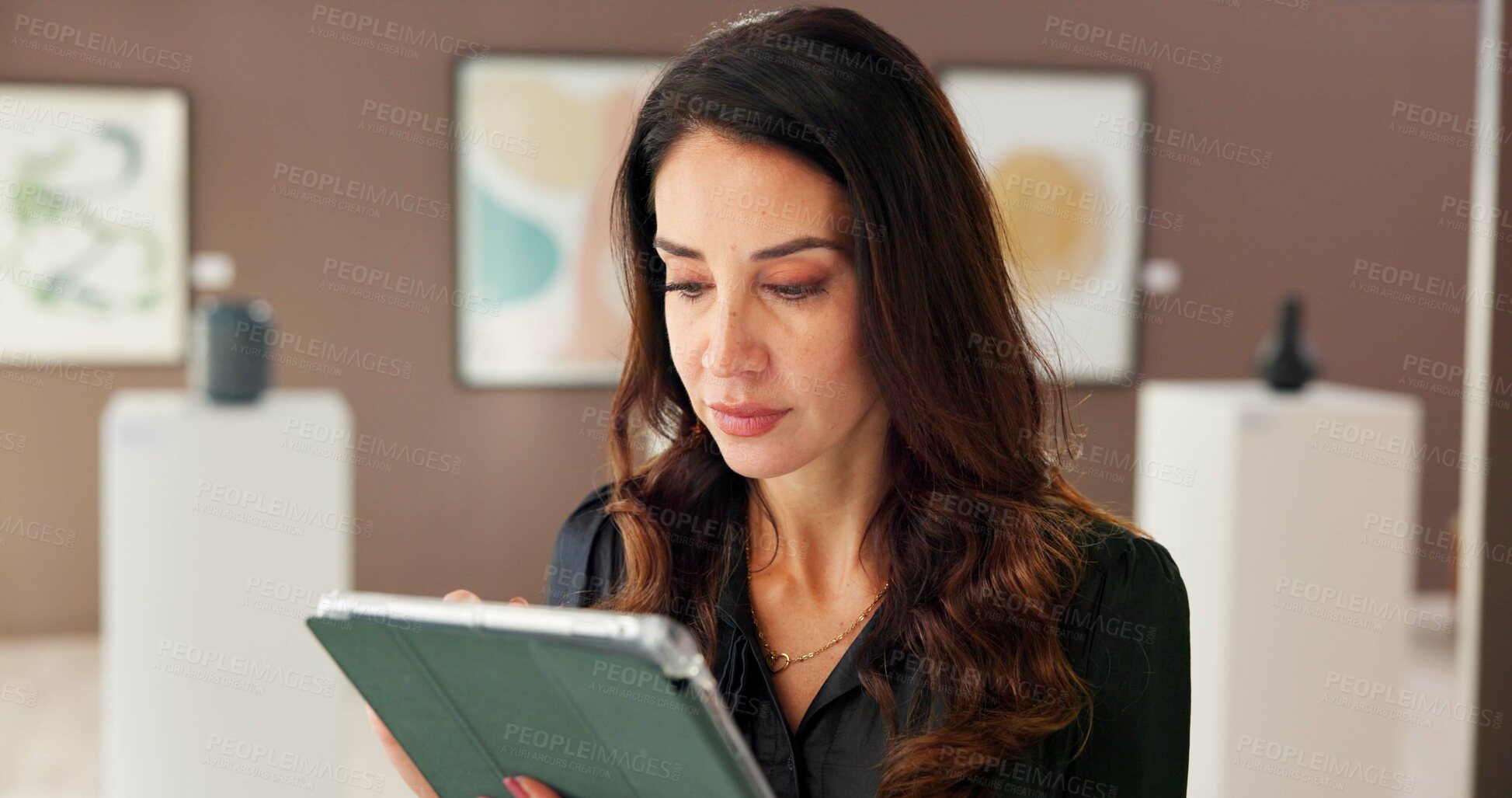 Buy stock photo Creative, woman and reading on tablet at gallery for research, artwork information and schedule event. Female curator, digital and social media reviews, online auction and art catalog for exhibition