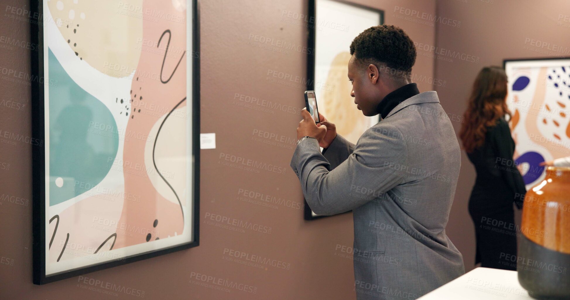 Buy stock photo Art gallery, canvas and man in museum with phone for social media, online post and creative blog. Auction, exhibition and person photograph artwork for research, artist information and review