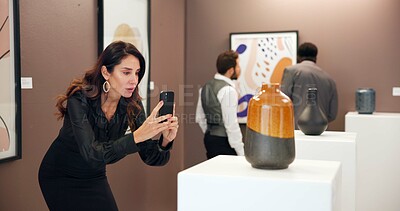 Buy stock photo Art gallery, picture and woman in museum with phone for social media, online post and creative blog. Auction, exhibition and person photograph ceramic vase for research, artwork information or review