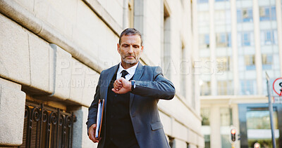 Buy stock photo Businessman, walking and checking watch in city for travel delay, schedule or running late. Man, attorney or lawyer with wristwatch for time, deadline or court case appointment in an urban town