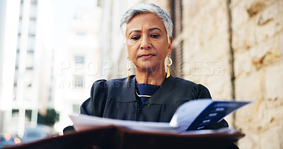 Buy stock photo Documents, reading and walking with lawyer woman outdoor for preparation of court case or trial. Commute, file or information and mature attorney in city with legislation for legal representation