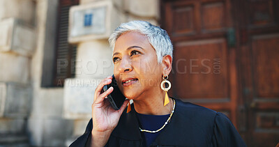 Buy stock photo Phone call, lawyer and woman in city, discussion and documents with legal aid service. Outdoor, mature person and attorney with cellphone, litigation and folder for court case, talking or negotiation