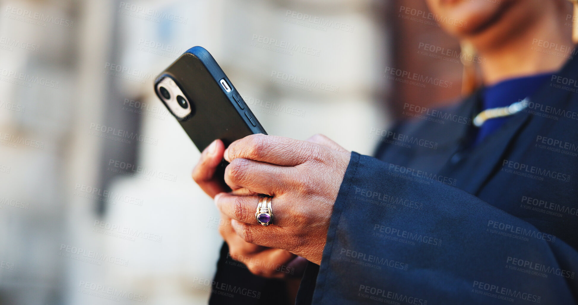 Buy stock photo Phone, hands and businesswoman in city with communication, contact or email with legal client. Cellphone, research and closeup of female attorney with online networking for law case in urban town.