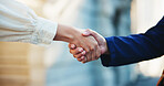 Teamwork, business people and handshake in city for agreement, real estate deal or sale. Closeup, shaking hands and partnership for property investment, collaboration together and thank you outdoor