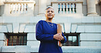 Lawyer, folder and portrait with business woman in city for court case files, trial assessment and attorney brief. Plead agreement, low angle and advocate paperwork with mature person outdoor