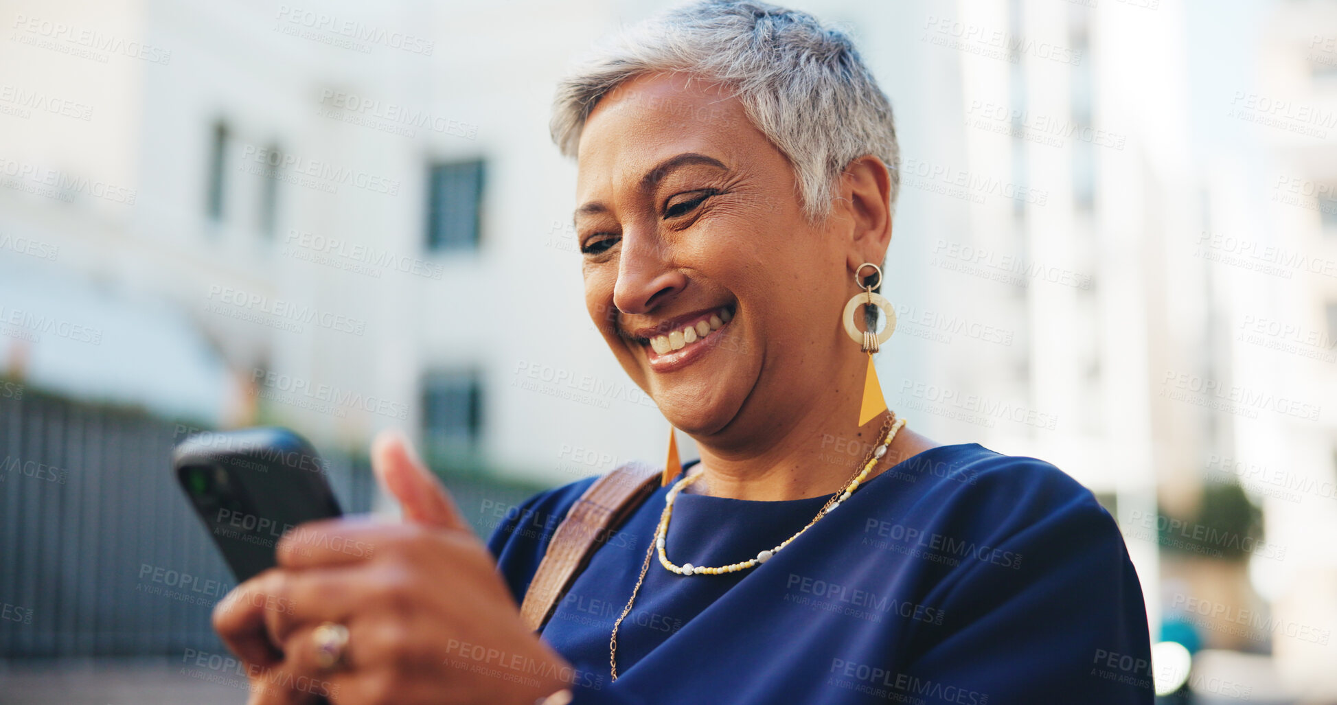 Buy stock photo Smile, reading and phone with business woman in city for communication, real estate listing and connection. Networking, client feedback and property viewing schedule with mature person outdoor 