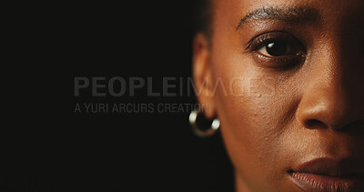 Buy stock photo Fear, portrait and space with black woman in studio for mental health, PTSD and stress on dark background. Half face, serious and trauma with person on mockup for abuse, crisis and depression closeup