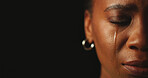 Sad, crying and woman in studio for crisis, ptsd or mental health on black background with closeup. Tears, half face and unhappy person with trauma from abuse, stress and depression with mockup space