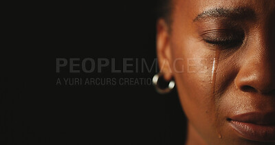Buy stock photo Sad, crying and woman in studio for crisis, ptsd or mental health on black background with closeup. Tears, half face and unhappy person with trauma from abuse, stress and depression with mockup space
