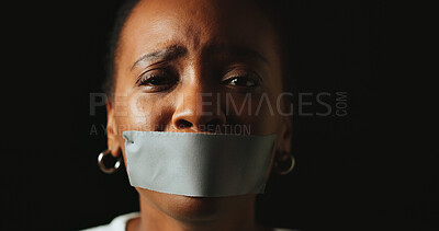 Buy stock photo Woman, tape and mouth with stress in studio for silence, voice and anxiety by black background. African person, cover lips and portrait with depression, sad and mental health with space in Nigeria