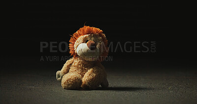 Buy stock photo Dark, shadow and teddy bear in studio for loss, isolation and forgotten toy on ground. Night, floor and stuffed animal on black mockup space for neglect, abandonment and unwanted with lost hope