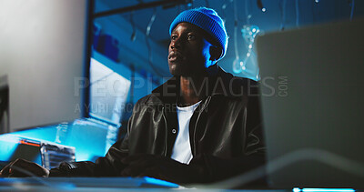 Buy stock photo Black man, hacker and reading on pc at night for programming, cyber attack and online information. Male person, computer and research for website phishing, data protection and criminal for fraud risk