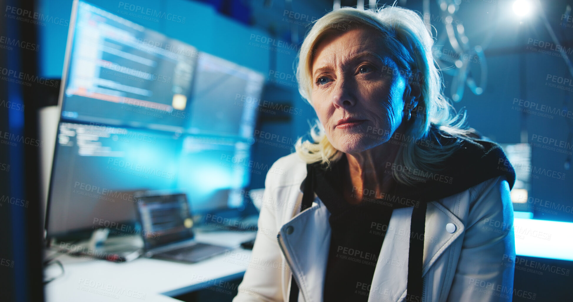 Buy stock photo Mature woman, reading and computer at night for programming, cyber attack and online information. Female person, pc and research for website phishing, data protection and criminal for hacking danger