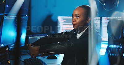 Buy stock photo Hacker, serious and woman with computer, night and data for cyber espionage, system and phishing in office. Online, programmer and black person with tech for ransomware, spy and hacking for fraud