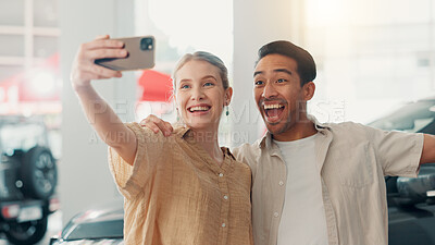 Buy stock photo Couple, excited and photography with selfie in car dealership, celebration and picture of new motor. Showroom, man and woman with hug for vehicle purchase, auto transport and memory for social media