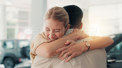 Buy stock photo Couple, woman and excited with hug in car dealership, celebration and appreciation for new motor. Showroom, man and happy partner with love embrace for vehicle purchase, auto transport and thank you
