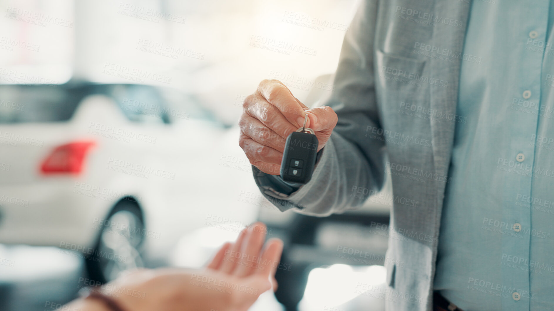 Buy stock photo Dealership, salesman and customer with hands for car keys, test drive and success purchase of motor. Showroom, people and giving equipment in closeup for buying vehicle, rental service and automobile