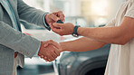 New car, handshake or salesman with keys for buyer, purchase success or transport hire in dealership. Shaking hands, giving or customer with people or closeup for automobile, loan or rental agreement