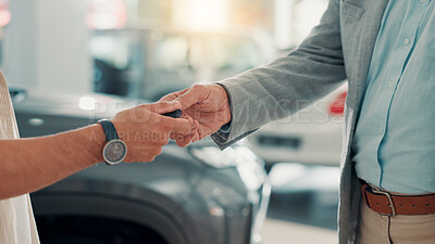 Buy stock photo Dealership, businessman and customer with hands for car keys, test drive and success purchase of motor. Showroom, people and giving equipment in closeup for buying vehicle, rental service and seller