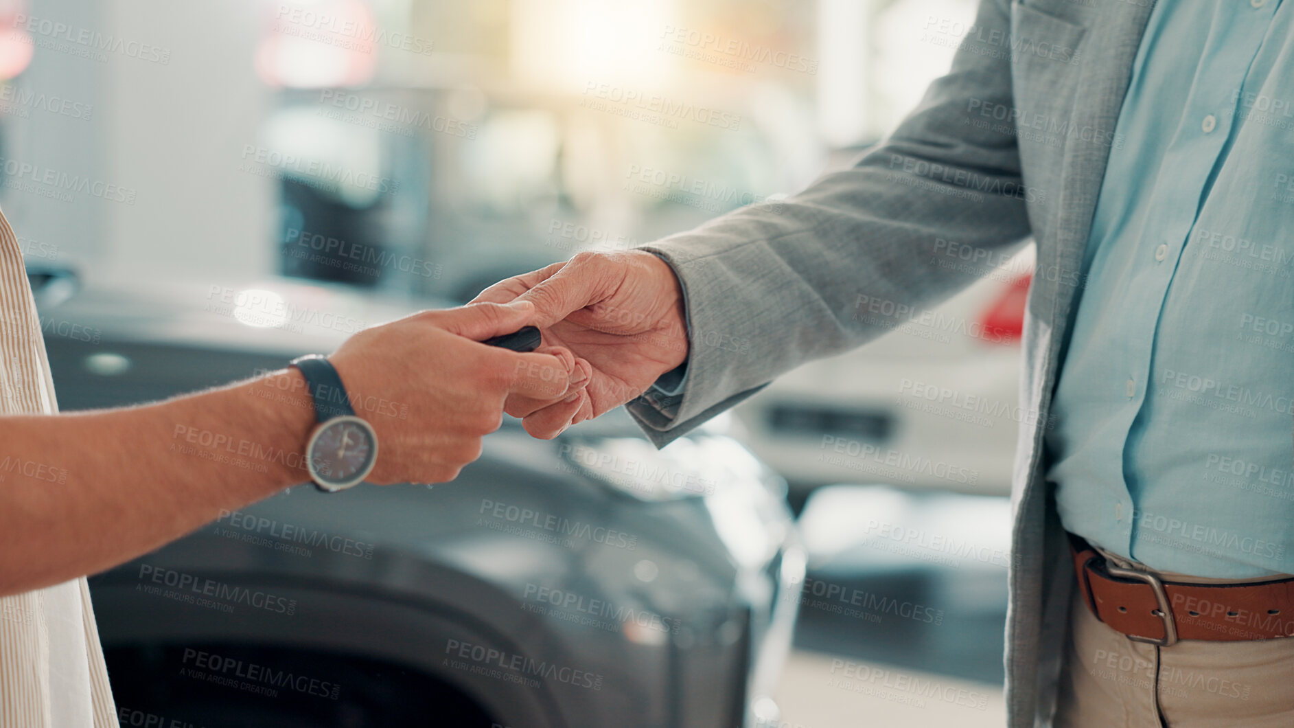 Buy stock photo Dealership, businessman and customer with hands for car keys, test drive and success purchase of motor. Showroom, people and giving equipment in closeup for buying vehicle, rental service and seller