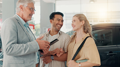 Buy stock photo Excited, new car or couple in dealership with salesman, tablet or investment in auto insurance. Smile, retail or people in showroom shopping for vehicle report, customer satisfaction or motor sales