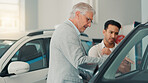 Customer,  man and sale at car dealership for advice, consulting or negotiation in vehicle finance. Deal, discussion and shopping on showroom floor with trade representative for auto insurance