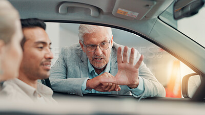 Buy stock photo Drive, salesman and couple with talking in car dealership, transport model and rental service. Showroom, people and mature seller with pitch for vehicle features, assistance and discussion by flare