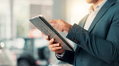 Buy stock photo Businessman, hands and scroll with tablet for car dealership, reading or website for motor rental service. Closeup, male person and seller with tech for inventory information, vehicle shop and typing
